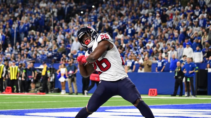 Jan 6, 2024; Indianapolis, Indiana, USA; Houston Texans running back Devin Singletary (26) celebrates after a touchdown against the Indianapolis Colts during the second half at Lucas Oil Stadium.  