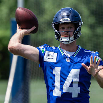 Jun 11, 2025; Renton, WA, USA; Seattle Seahawks quarterback Sam Darnold (14) passes the ball during mini-camp at Virginia Mason Athletic Center. Mandatory Credit: Stephen Brashear-Imagn Images
