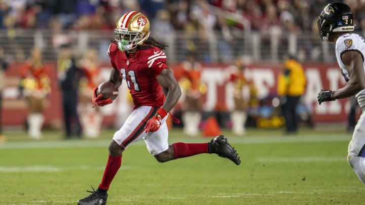 Dec 25, 2023; Santa Clara, California, USA; San Francisco 49ers wide receiver Brandon Aiyuk (11) rushes with the ball during the fourth quarter against the Baltimore Ravens at Levi's Stadium. Mandatory Credit: Neville E. Guard-USA TODAY Sports