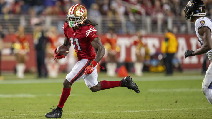 Dec 25, 2023; Santa Clara, California, USA; San Francisco 49ers wide receiver Brandon Aiyuk (11) rushes with the ball during the fourth quarter against the Baltimore Ravens at Levi's Stadium. Mandatory Credit: Neville E. Guard-USA TODAY Sports