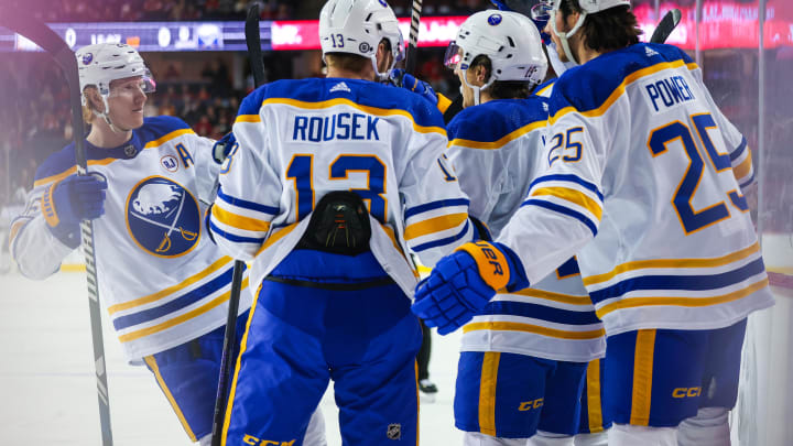 Mar 24, 2024; Calgary, Alberta, CAN; Buffalo Sabres center Peyton Krebs (19) celebrates his goal with teammates against the Calgary Flames during the first period at Scotiabank Saddledome. Mandatory Credit: Sergei Belski-USA TODAY Sports