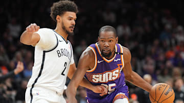 Nov 27, 2024; Phoenix, Arizona, USA; Phoenix Suns forward Kevin Durant (35) drives against Brooklyn Nets forward Cameron Johnson (2) during the first half at Footprint Center. Mandatory Credit: Joe Camporeale-Imagn Images