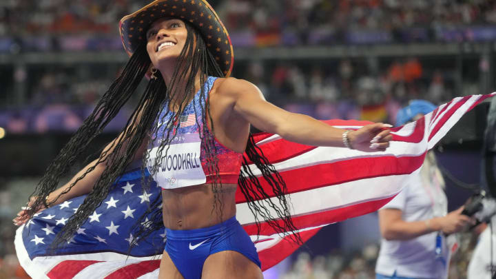 Aug 8, 2024; Saint-Denis, FRANCE; Tara Davis-Woodhall (USA) celebrates winning the women's long jump final during the Paris 2024 Olympic Summer Games at Stade de France. 