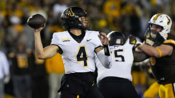 Sep 23, 2023; Laramie, Wyoming, USA; Appalachian State Mountaineers quarterback Joey Aguilar (4) looks to throw  against the Wyoming Cowboys during the third quarter at Jonah Field at War Memorial Stadium. Mandatory Credit: Troy Babbitt-USA TODAY Sports