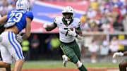 Sep 6, 2025; Dallas, Texas, USA; Baylor Bears running back Bryson Washington (7) runs with the ball during the game between the SMU Mustangs and the Baylor Bears at Gerald J. Ford Stadium. Mandatory Credit: Jerome Miron-Imagn Images