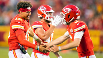 Aug 25, 2022; Kansas City, Missouri, USA; Kansas City Chiefs quarterback Patrick Mahomes (15) congratulates quarterback Shane Buechele (6) after a touchdown against the Green Bay Packers during the first half at GEHA Field at Arrowhead Stadium. Mandatory Credit: Jay Biggerstaff-Imagn Images