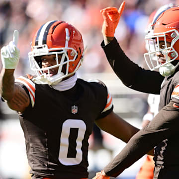 Oct 27, 2024; Cleveland, Ohio, USA; Cleveland Browns cornerback Greg Newsome II (0) and safety Juan Thornhill (1) celebrate after a pass break up during the first half against the Baltimore Ravens at Huntington Bank Field. Mandatory Credit: Ken Blaze-Imagn Images