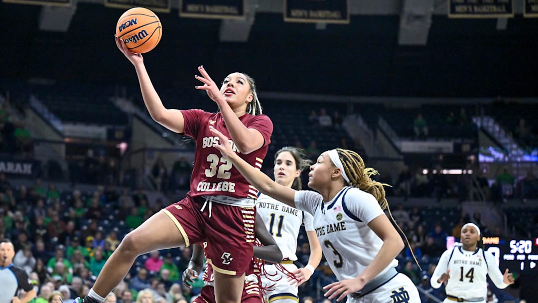 Jan 11, 2024; South Bend, Indiana, USA; Boston College Eagles forward Teya Sidberry (32) goes up for a shot as Notre Dame Fighting Irish guard Hannah Hidalgo (3) defends in the first half at the Purcell Pavilion. Mandatory Credit: Matt Cashore-Imagn Images