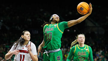 Notre Dame forward Liatu King (20) reaches out for a rebound during a NCAA women's basketball game between No. 3 Notre Dame and No. 25 Louisville at Purcell Pavilion on Sunday, March 2, 2025, in South Bend.