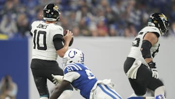 Jan 5, 2025; Indianapolis, Indiana, USA; Indianapolis Colts defensive end Kwity Paye (51) misses the sack on Jacksonville Jaguars quarterback Mac Jones (10) during a game against the Jacksonville Jaguars at Lucas Oil Stadium. Mandatory Credit: Grace Hollars/USA TODAY Network via Imagn Images