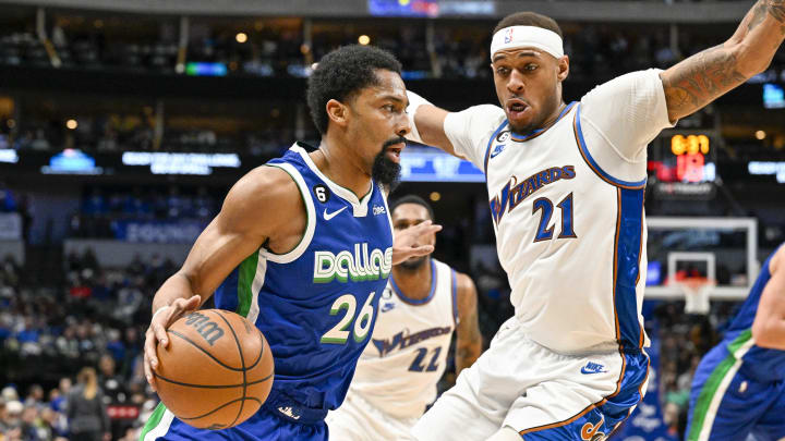 Jan 24, 2023; Dallas, Texas, USA; Dallas Mavericks guard Spencer Dinwiddie (26) drives to the basket past Washington Wizards center Daniel Gafford (21) during the first quarter at the American Airlines Center. Mandatory Credit: Jerome Miron-USA TODAY Sports