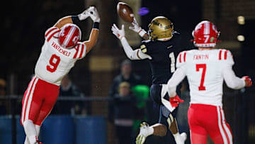 Penn's Tayshon Bardo (1) drops a catch in the end zone with Crown Point's Griffin Van Tichelt (9) guarding during the IHSAA Class 6A Sectional final between No. 2 Crown Point and Penn at Penn High School on Friday, Nov. 8, 2024, in Mishawaka.