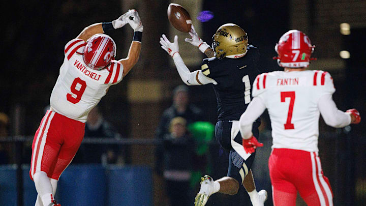 Penn's Tayshon Bardo (1) drops a catch in the end zone with Crown Point's Griffin Van Tichelt (9) guarding during the IHSAA Class 6A Sectional final between No. 2 Crown Point and Penn at Penn High School on Friday, Nov. 8, 2024, in Mishawaka.