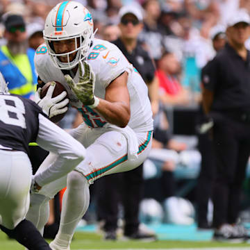 Miami Dolphins tight end Julian Hill (89) runs with the football against Las Vegas Raiders cornerback Jack Jones (18) during the fourth quarter at Hard Rock Stadium. 