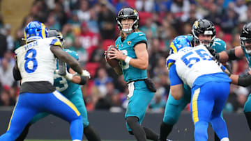 Oct 19, 2025; London, United Kingdom; Jacksonville Jaguars quarterback Trevor Lawrence (16) looks to pass the ball against the Los Angeles Rams during the first half of an NFL International Series game at Wembley Stadium. 