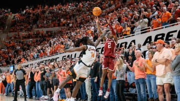 Feb 24, 2024; Stillwater, Oklahoma, USA; Oklahoma Sooners guard Javian McCollum (2) shoots the ball over Oklahoma State Cowboys guard Jamyron Keller (14) to win the game in overtime at Gallagher-Iba Arena. Mandatory Credit: William Purnell-USA TODAY Sports