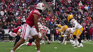 Nov 29, 2024; Madison, Wisconsin, USA;  The Wisconsin Badgers line up for a play during the second quarter against the Minnesota Golden Gophers at Camp Randall Stadium. Mandatory Credit: Jeff Hanisch-Imagn Images
