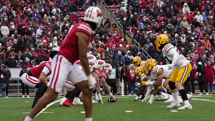 Nov 29, 2024; Madison, Wisconsin, USA;  The Wisconsin Badgers line up for a play during the second quarter against the Minnesota Golden Gophers at Camp Randall Stadium. Mandatory Credit: Jeff Hanisch-Imagn Images