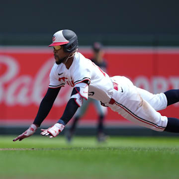 Aug 9, 2024; Minneapolis, Minnesota, USA; Minnesota Twins center fielder Byron Buxton (25) slides into second base with a double against the Cleveland Guardians during the sixth inning at Target Field.