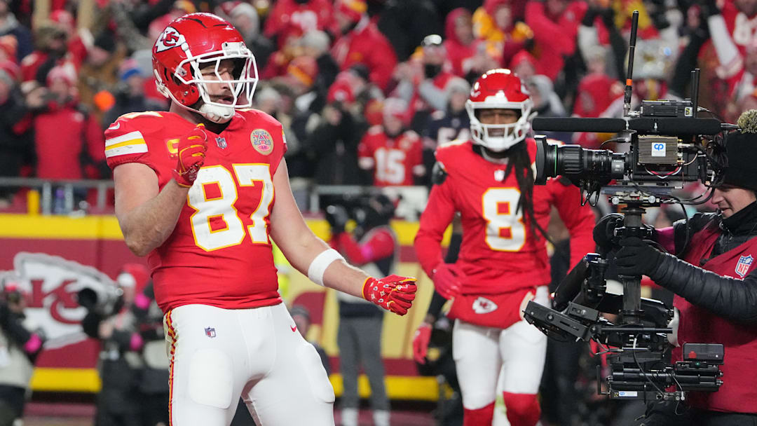 Jan 18, 2025; Kansas City, Missouri, USA; Kansas City Chiefs tight end Travis Kelce (87) reacts after catching a pass for a touchdown against the Houston Texans during the fourth quarter of a 2025 AFC divisional round game at GEHA Field at Arrowhead Stadium. Mandatory Credit: Denny Medley-Imagn Images