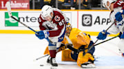 Nov 2, 2024; Nashville, Tennessee, USA;  Nashville Predators goaltender Juuse Saros (74) blocks the shot of Colorado Avalanche center Nikita Prishchepov (85) during the second period at Bridgestone Arena. Mandatory Credit: Steve Roberts-Imagn Images