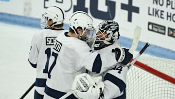 Blue Jackets prospect and Penn State defenseman Jackson Smith (7) celebrates a win over Clarkson with his teammates.