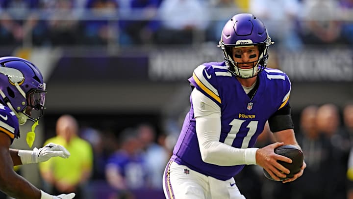 Oct 19, 2025; Minneapolis, Minnesota, USA; Minnesota Vikings quarterback Carson Wentz (11) hands off the ball during the first half against the Philadelphia Eagles at U.S. Bank Stadium. Mandatory Credit: Jeffrey Becker-Imagn Images