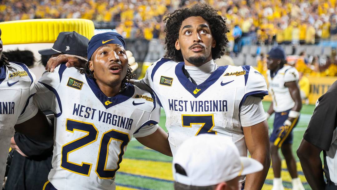 Sep 19, 2026; Charlotte, North Carolina, USA; West Virginia Mountaineers payers sing “Country Roads” after defeating the Virginia Cavaliers at Bank of America Stadium. Mandatory Credit: Ben Queen-Imagn Images