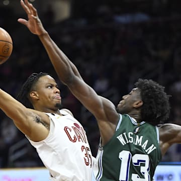 Mar 4, 2023; Cleveland, Ohio, USA; Cleveland Cavaliers forward Isaac Okoro (35) drives to the basket beside Detroit Pistons guard R.J. Hampton (13) in the third quarter at Rocket Mortgage FieldHouse. Mandatory Credit: David Richard-Imagn Images