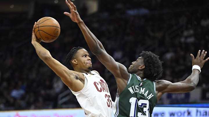 Mar 4, 2023; Cleveland, Ohio, USA; Cleveland Cavaliers forward Isaac Okoro (35) drives to the basket beside Detroit Pistons guard R.J. Hampton (13) in the third quarter at Rocket Mortgage FieldHouse. Mandatory Credit: David Richard-Imagn Images