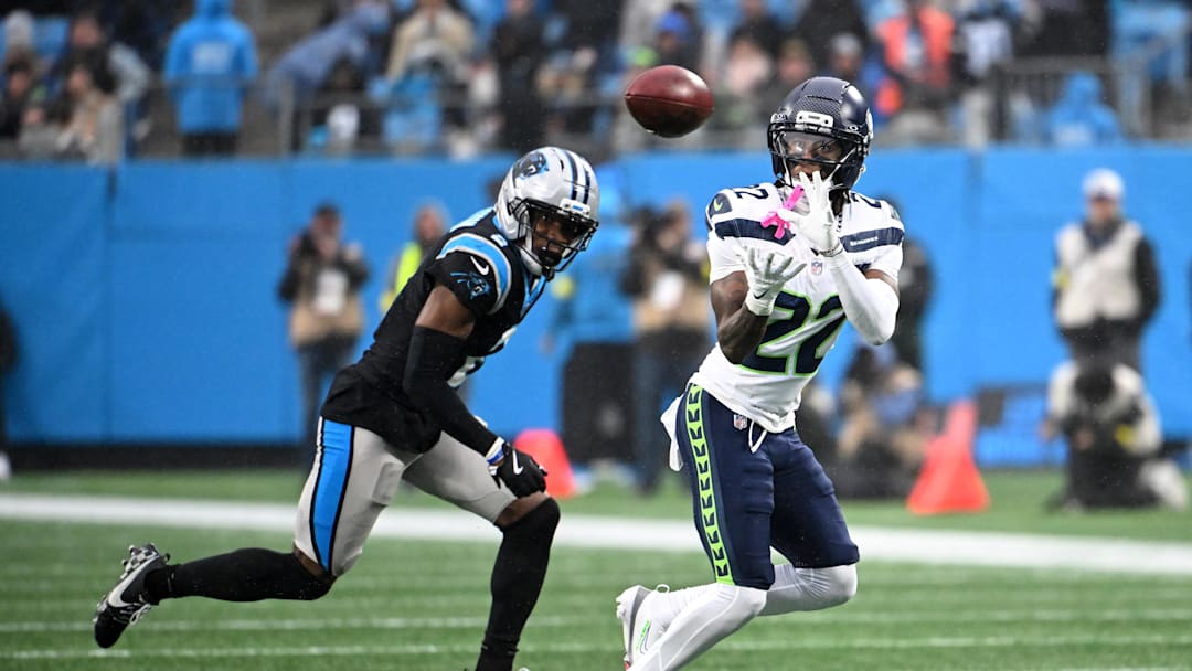 Dec 28, 2025; Charlotte, North Carolina, USA; Seattle Seahawks wide receiver Rashid Shaheed (22) catches a pass against Carolina Panthers cornerback Mike Jackson (2) during the first quarter at Bank of America Stadium. Mandatory Credit: Bob Donnan-Imagn Images