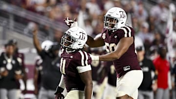 Oct 11, 2025; College Station, Texas, USA; Texas A&M Aggies defensive tackle Tyler Onyedim (11) and defensive end Dayon Hayes (50) react during the fourth quarter against the Florida Gators at Kyle Field. Mandatory Credit: Maria Lysaker-Imagn Images 