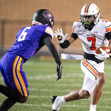 Valley’s Jayden McGregory (7) looks to get past his defender, Johnston's Caleb Gbarjolo (6), on Nov. 7, 2025, at Johnston High School.