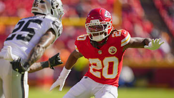 Oct 19, 2025; Kansas City, Missouri, USA; Kansas City Chiefs cornerback Nohl Williams (20) defends Las Vegas Raiders cornerback Decamerion Richardson (25) during the second half at GEHA Field at Arrowhead Stadium. Mandatory Credit: Jay Biggerstaff-Imagn Images