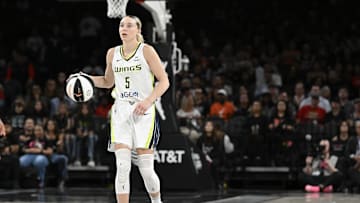 Jun 13, 2025; Las Vegas, Nevada, USA; Dallas Wings guard Paige Bueckers (5) dribbles the ball against the Las Vegas Aces in the fourth quarter of their game at Michelob Ultra Arena. Mandatory Credit: Candice Ward-Imagn Images