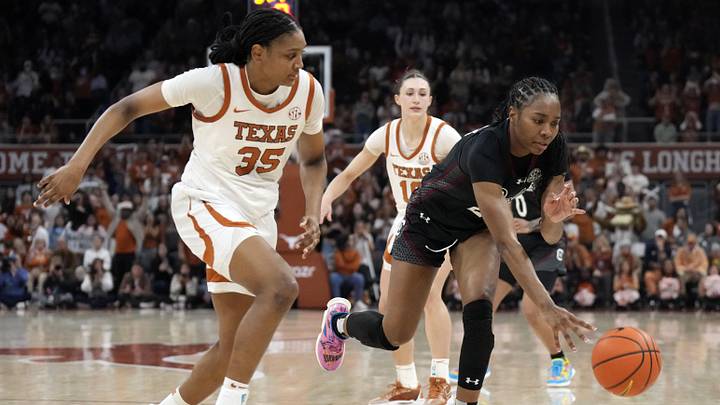 Feb 9, 2025; Austin, Texas, USA; South Carolina Gamecocks guard Bree Hall (23) battles for the ball with Texas Longhorns forward Madison Booker (35) during the second half at Moody Center. Mandatory Credit: Scott Wachter-Imagn Images