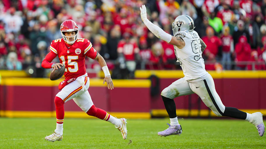 Kansas City Chiefs quarterback Patrick Mahomes scrambles against Las Vegas Raiders defensive end Maxx Crosby
