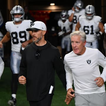 Aug 7, 2025; Seattle, Washington, USA; Las Vegas Raiders head coach Pete Carroll runs out of the tunnel before the second half against the Seattle Seahawks at Lumen Field. Mandatory Credit: Steven Bisig-Imagn Images