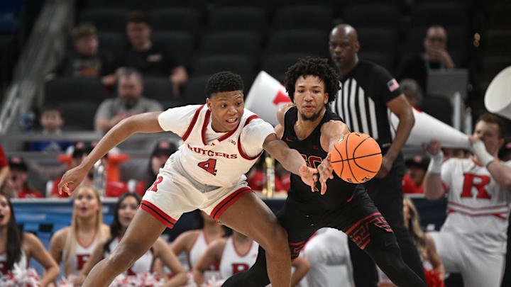 USC Trojans guard Desmond Claude knocks the ball away from Rutgers Scarlet Knights guard Ace Bailey during the second half 