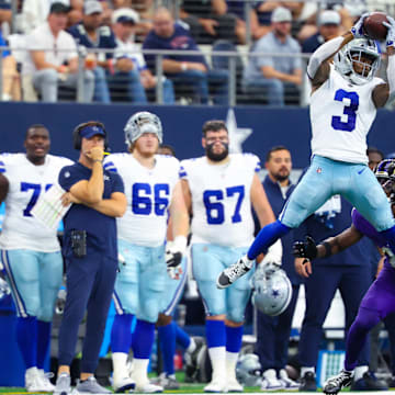 Dallas Cowboys wide receiver Brandin Cooks makes a catch in front of Baltimore Ravens cornerback Brandon Stephens.