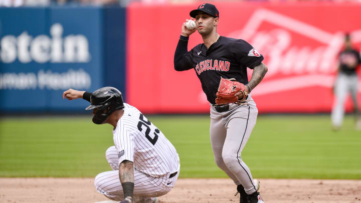 Aug 22, 2024; Bronx, New York, USA; Cleveland Guardians shortstop Brayan Rocchio (4) gets a force out at second base against New York Yankees second baseman Gleyber Torres (25) during the fifth inning at Yankee Stadium. Mandatory Credit: John Jones-USA TODAY Sports