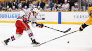 Dec 17, 2024; Nashville, Tennessee, USA;  Nashville Predators center Steven Stamkos (91) blocks the shot of of New York Rangers defenseman Chad Ruhwedel (5) during the second period at Bridgestone Arena. Mandatory Credit: Steve Roberts-Imagn Images
