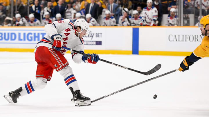 Dec 17, 2024; Nashville, Tennessee, USA;  Nashville Predators center Steven Stamkos (91) blocks the shot of of New York Rangers defenseman Chad Ruhwedel (5) during the second period at Bridgestone Arena. Mandatory Credit: Steve Roberts-Imagn Images