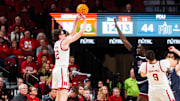 Nov 13, 2024; Lincoln, Nebraska, USA; Nebraska Cornhuskers guard Gavin Griffiths shoots the ball against Fairleigh Dickinson Knights forward Bismark Nsiah.