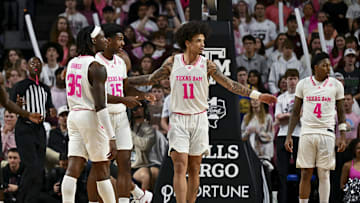 Jan 28, 2025; College Station, Texas, USA; Texas A&M Aggies forward Andersson Garcia (11) reacts with forward Henry Coleman III (15) and guard Manny Obaseki (35) against the Oklahoma Sooners at Reed Arena. The Aggies defeated the Sooners 75-68. Mandatory Credit: Maria Lysaker-Imagn Images 