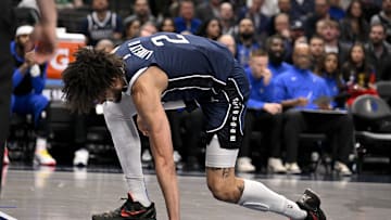 Jan 14, 2025; Dallas, Texas, USA; Dallas Mavericks center Dereck Lively II (2) reacts after suffering a possible leg injury during the first quarter against the Denver Nuggets at the American Airlines Center. 