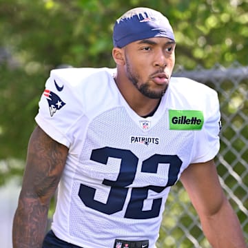 Jul 28, 2025; Foxborough, MA, USA; New England Patriots running back TreVeyon Henderson (32) heads to the practice fields for training camp at Gillette Stadium. Mandatory Credit: Eric Canha-Imagn Images