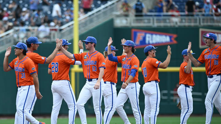 Jun 17, 2024; Omaha, NE, USA;  The Florida Gators celebrate the win against the NC State Wolfpack at Charles Schwab Field Omaha. Mandatory Credit: Steven Branscombe-USA TODAY Sports