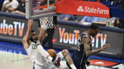 Jun 12, 2024; Dallas, Texas, USA; Boston Celtics forward Jayson Tatum (0) dunks against Dallas Mavericks forward P.J. Washington (25) during the second quarter in game three of the 2024 NBA Finals at American Airlines Center. Mandatory Credit: Jerome Miron-USA TODAY Sports