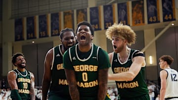 George Mason Patriots forward Jalen Haynes (11), guard K.D. Johnson (0), and guard Brayden O'Connor (4) celebrate gaining possession of the ball during the first half of the game against the Marquette Golden Eagles on Friday November 8 2024 at the Al McGuire Center in Milwaukee, Wis.
